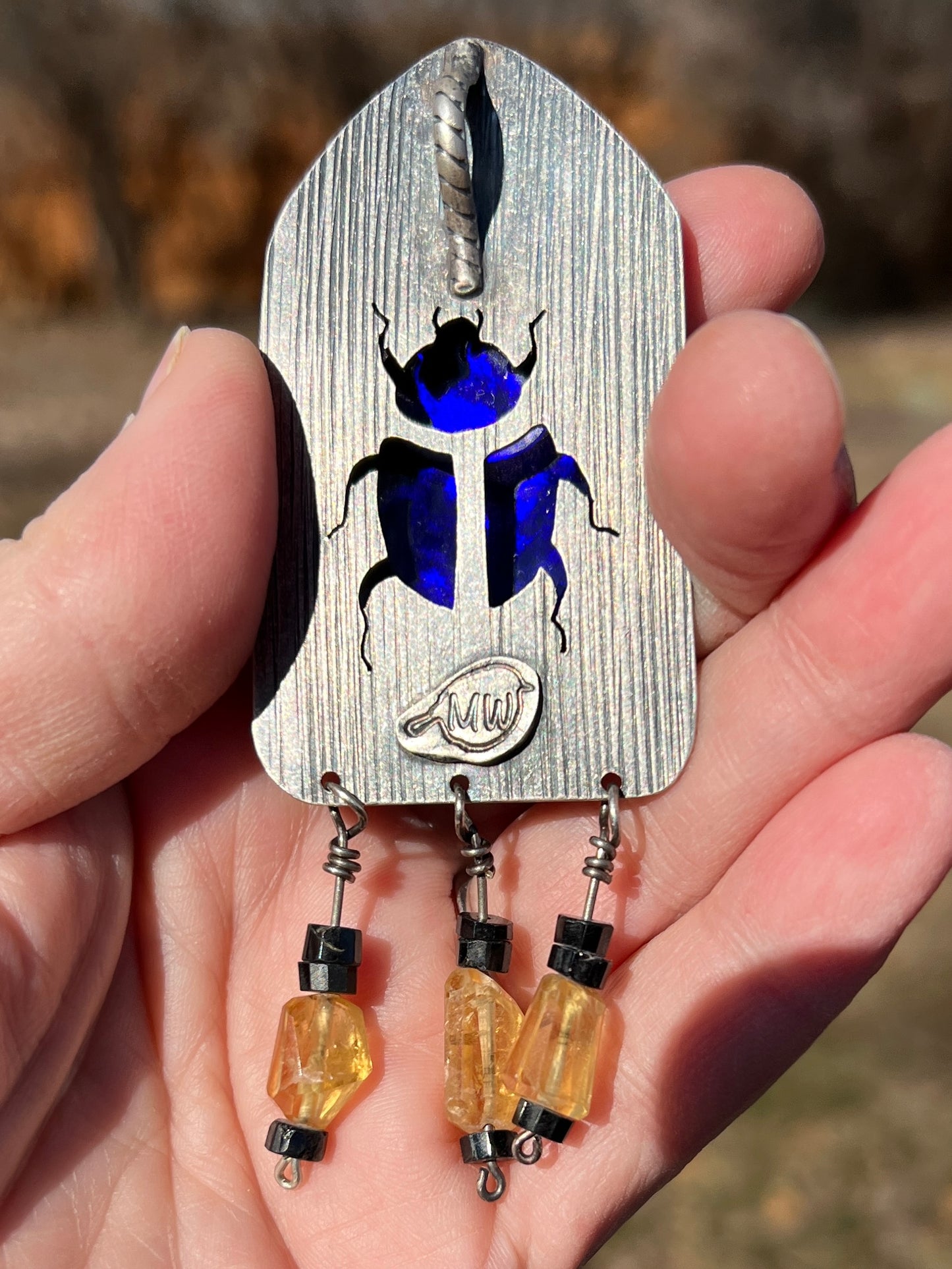 Isis enamel pendant